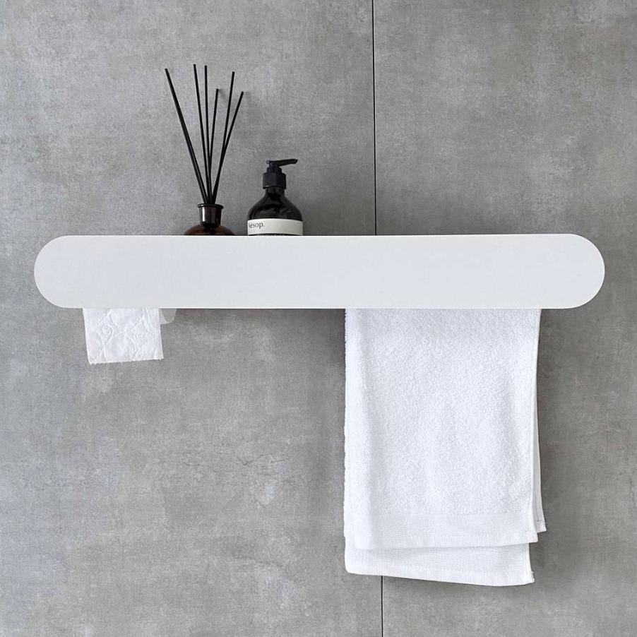 towel rack
towel holder
bathroom organizer
floating wall shelf
shelf and towel rail
wall-mounted shelf
bathroom shelf
bathroom wall shelf
shelf with towel bar
toilet paper holder
toilet roll holder
toilet paper storage
towel hanger